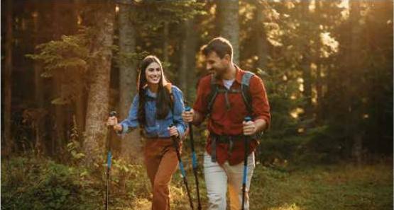 Couple walking on a forest trail